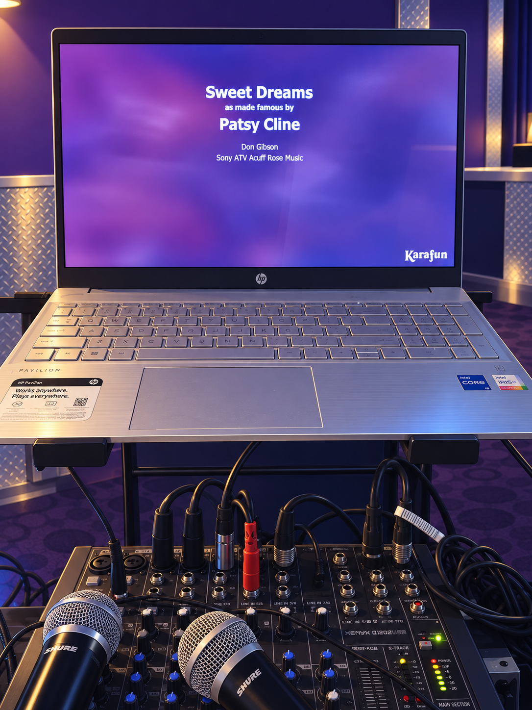 Karaoke laptop, microphones, and audio mixer